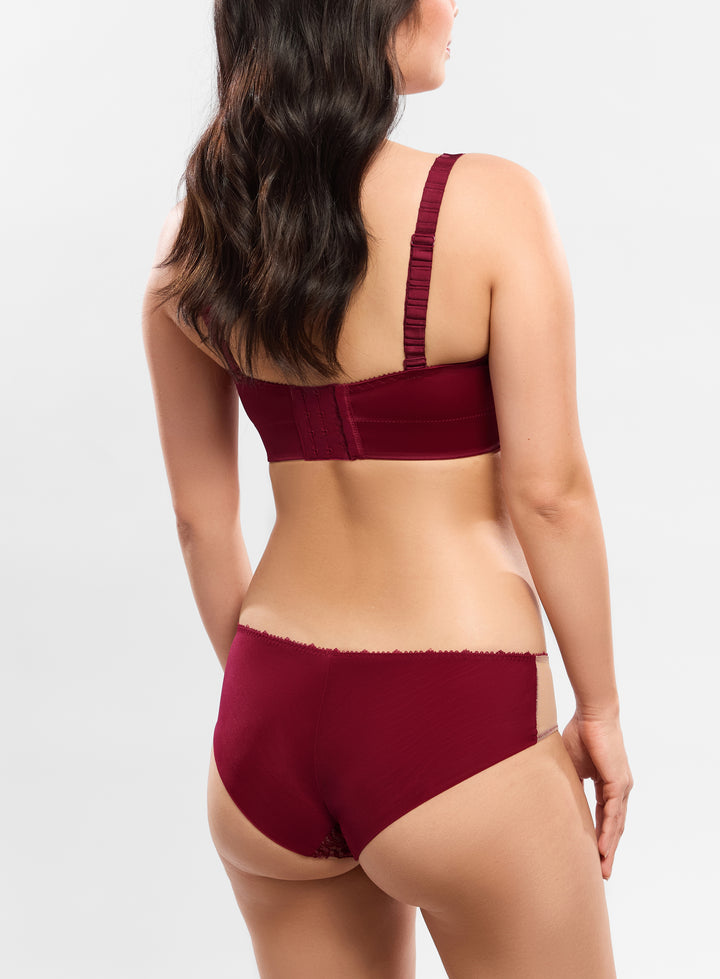 Burgundy lingerie set on a plain background