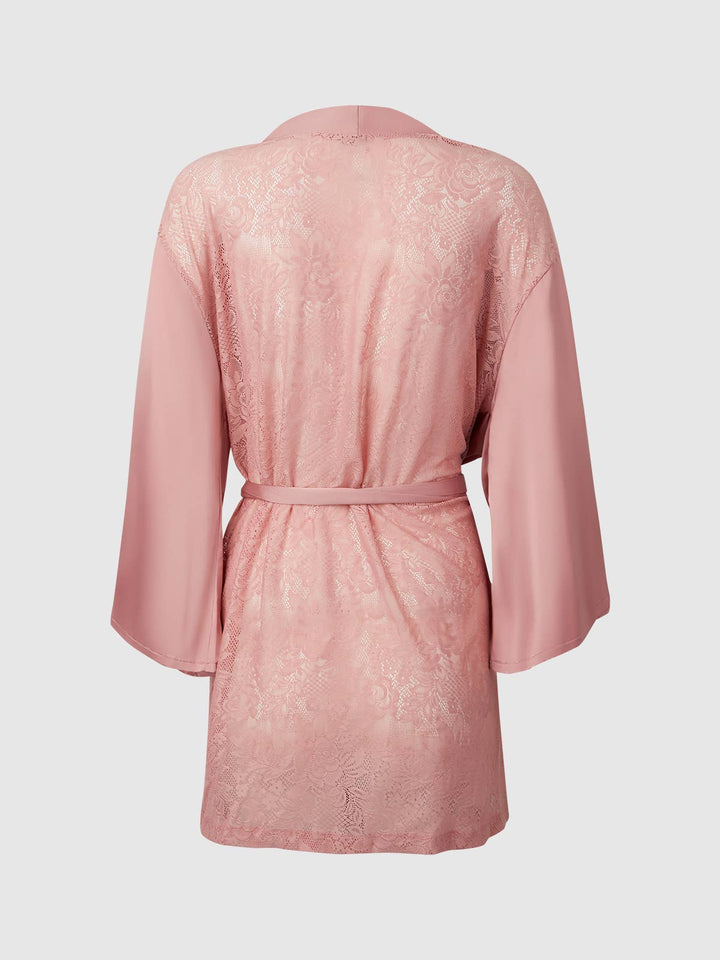 Pink lace robe on a light gray background