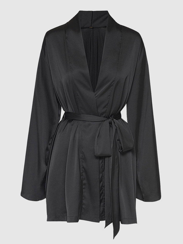 Black satin robe on a light gray background