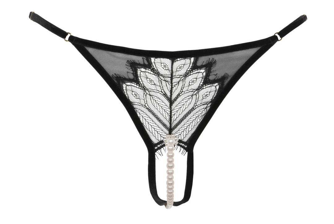 Black lace pearl thong with white embroidery on a white background