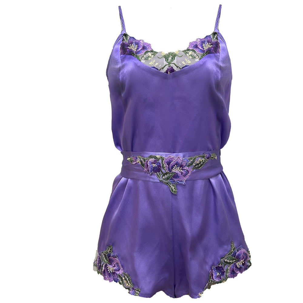 Purple satin romper with floral embroidery on a white background