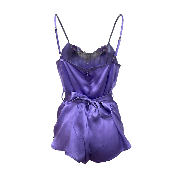 Purple satin romper with thin straps on a white background