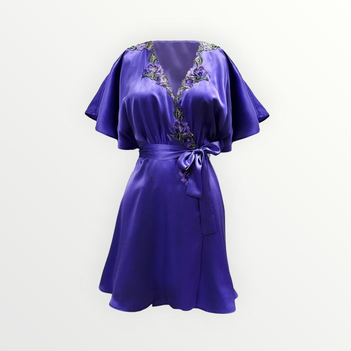 Purple dress with floral embroidery on a white background