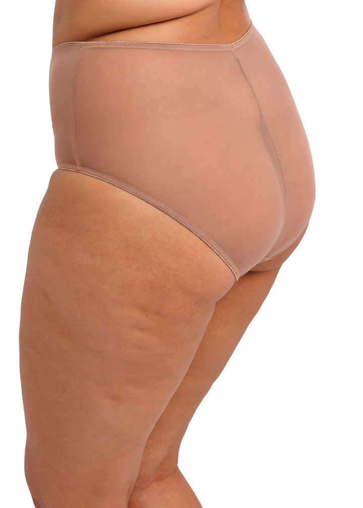 Beige shapewear being worn on a white background