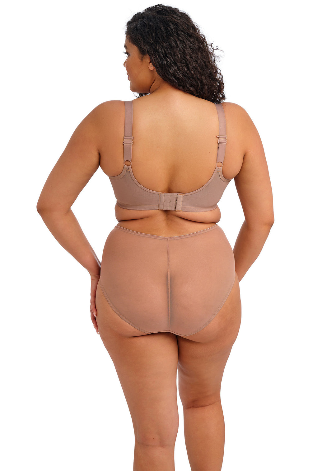 Woman wearing a beige shapewear outfit on a white background