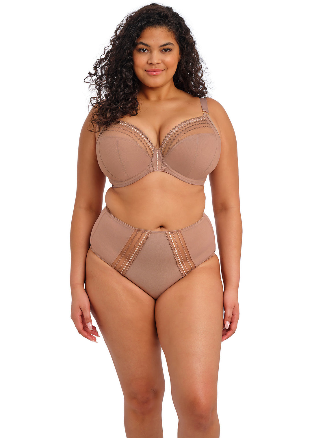 Woman wearing a beige lingerie set on a white background