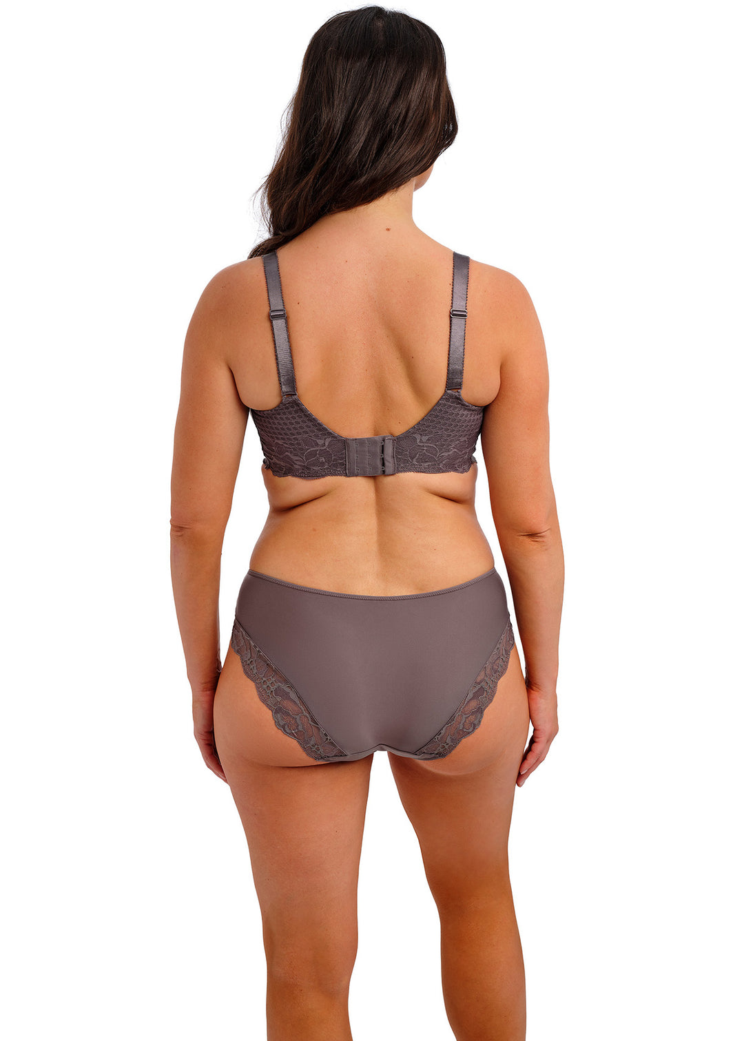 Woman wearing a brown lingerie set on a white background