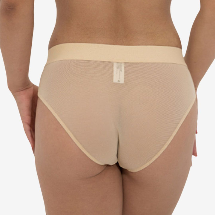 Beige lingerie set on a plain background