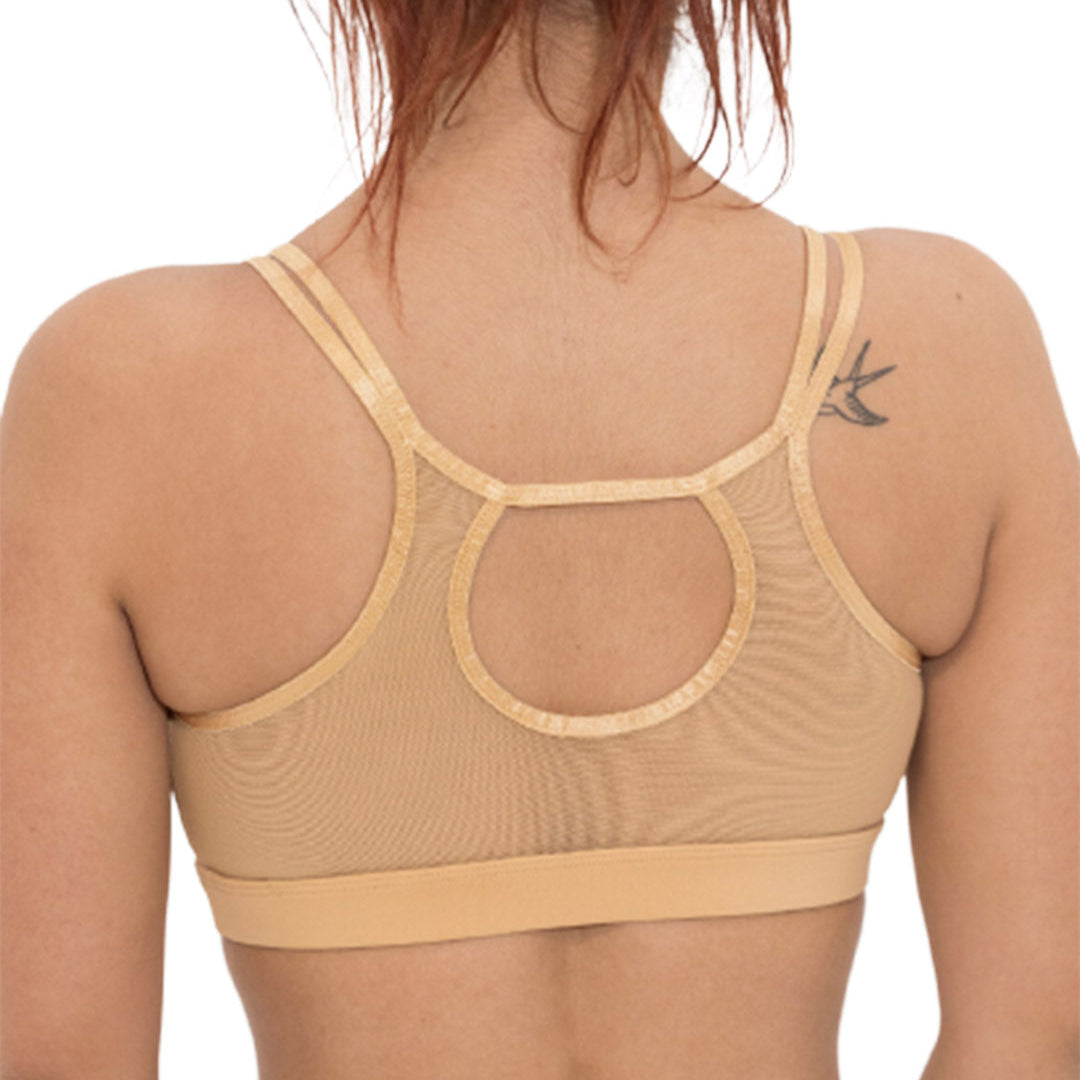 Beige bra and underwear set on a white background