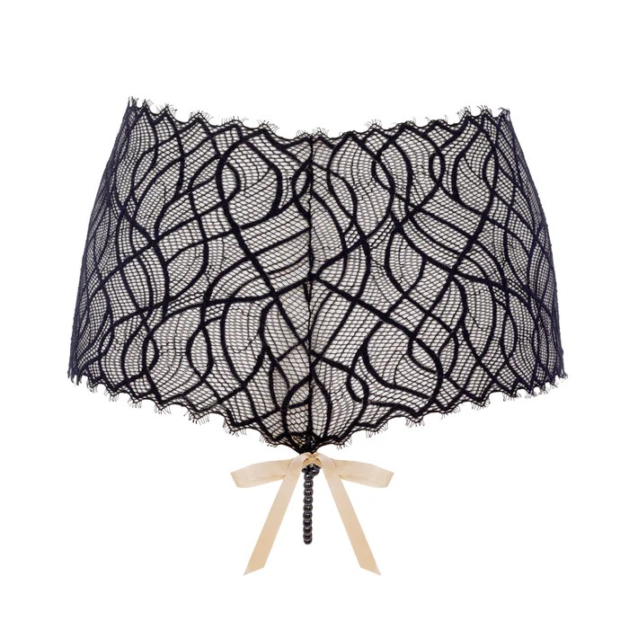 Black lace petticoat with a beige ribbon on a white background